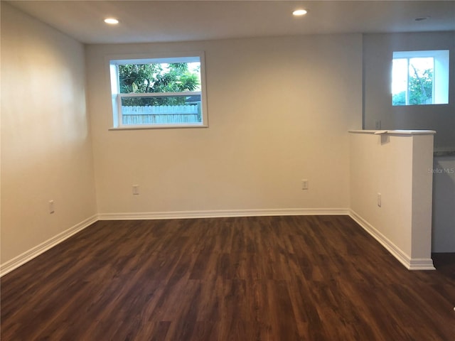 empty room with dark hardwood / wood-style floors