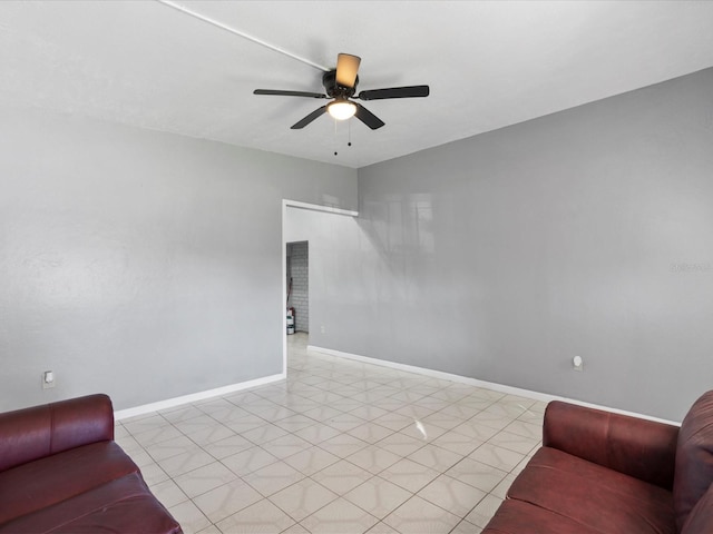 tiled living room with ceiling fan