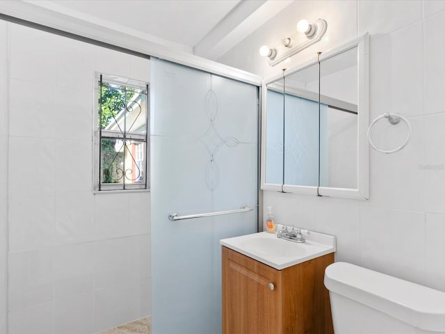 bathroom featuring vanity, an enclosed shower, tile walls, and toilet