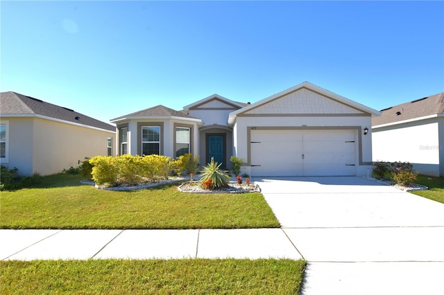 ranch-style house featuring a front lawn and a garage