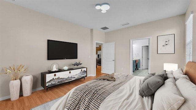 bedroom with light hardwood / wood-style floors