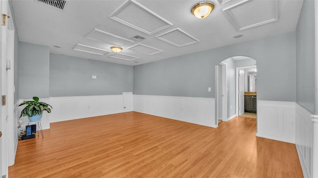 spare room featuring light hardwood / wood-style flooring