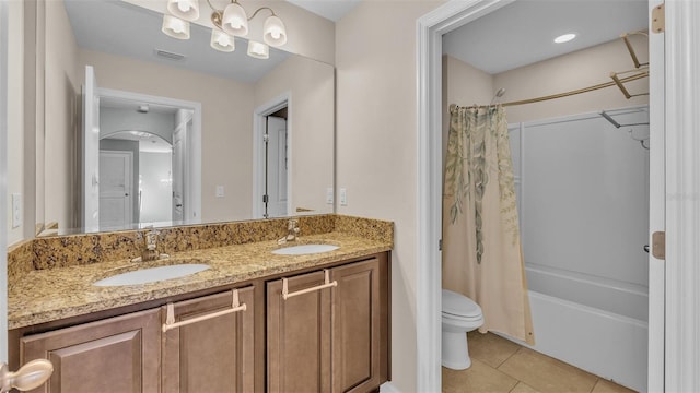 full bathroom featuring shower / bathtub combination with curtain, vanity, toilet, and tile patterned flooring