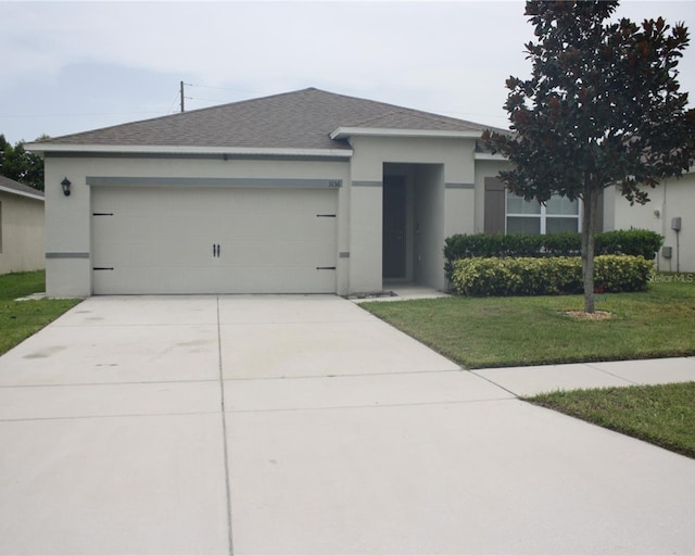 view of front facade featuring a front yard and a garage