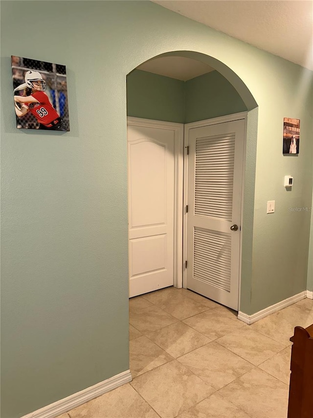 corridor featuring tile patterned floors