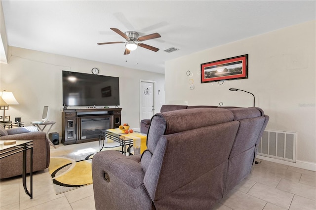 tiled living room featuring ceiling fan