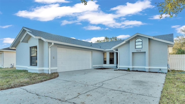 ranch-style house featuring a garage