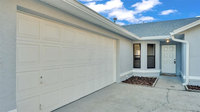 property entrance with a garage