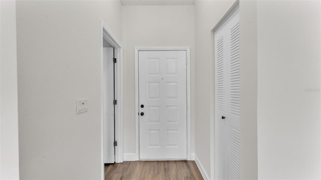 hall with light hardwood / wood-style flooring