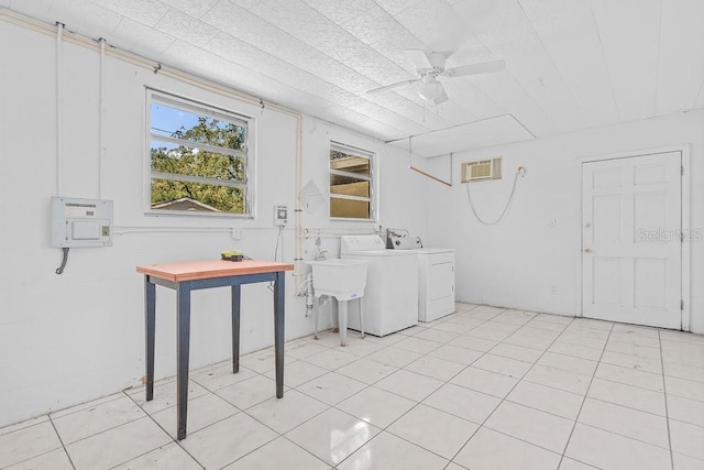 laundry area with separate washer and dryer, ceiling fan, sink, and light tile patterned floors