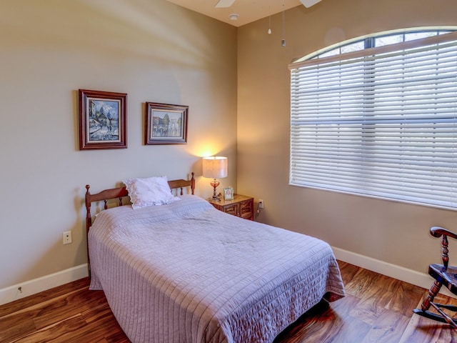 bedroom with ceiling fan and hardwood / wood-style floors