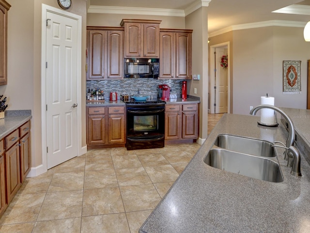 kitchen with decorative backsplash, sink, black appliances, and ornamental molding