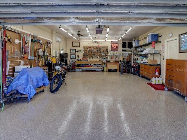 garage featuring a workshop area and a garage door opener