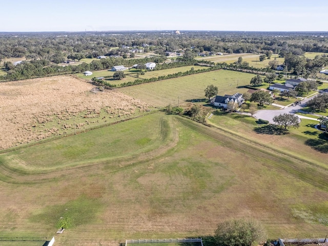 birds eye view of property featuring a rural view