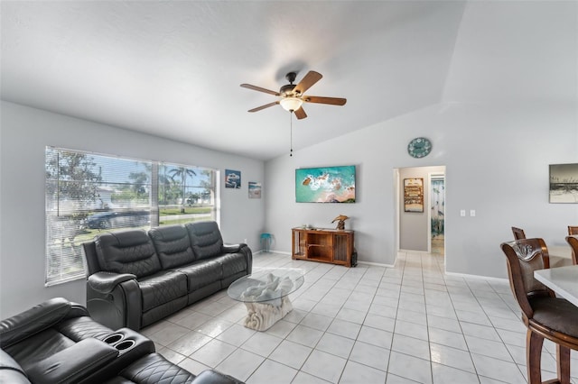 living room featuring vaulted ceiling, ceiling fan, and light tile patterned flooring