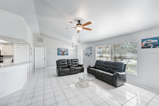 tiled living room with ceiling fan and lofted ceiling