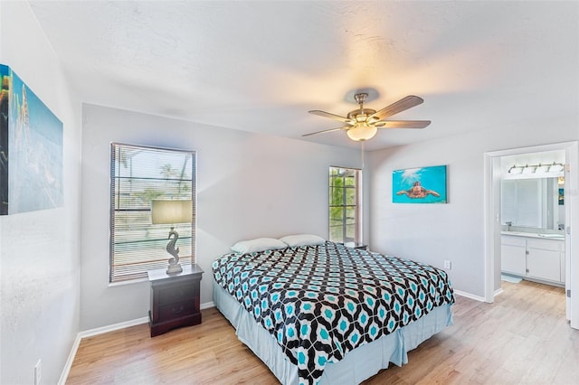 bedroom featuring multiple windows, ceiling fan, and light hardwood / wood-style floors