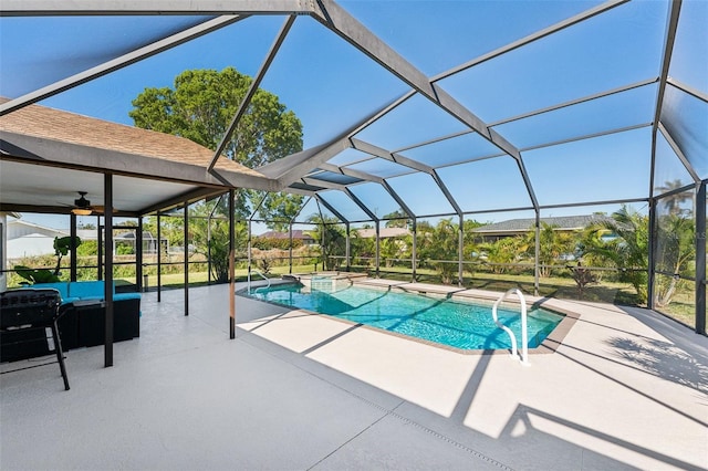 view of pool featuring a lanai, ceiling fan, and a patio area