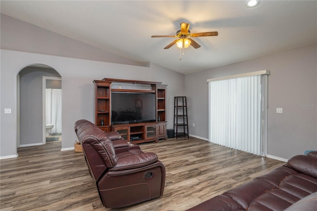 living room featuring ceiling fan, lofted ceiling, and hardwood / wood-style flooring