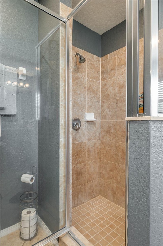 bathroom with tiled shower