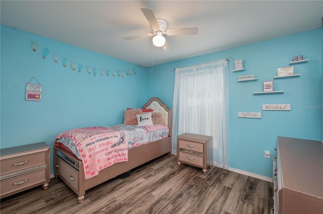 bedroom featuring dark hardwood / wood-style floors and ceiling fan