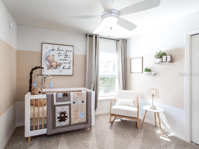 sitting room with carpet flooring and ceiling fan