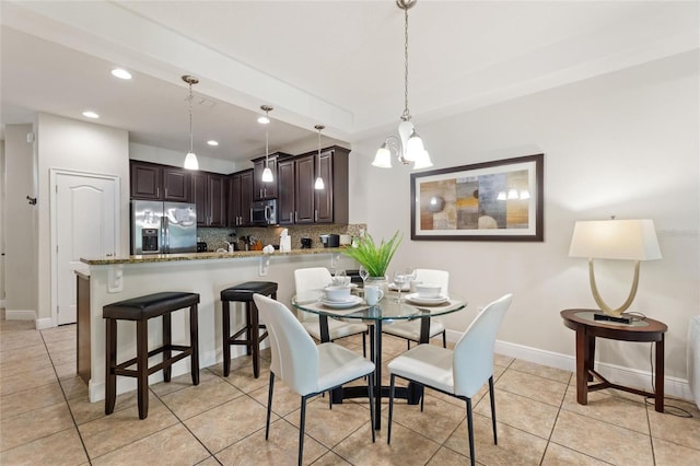 8205 Roseville, Davenport, FL 33896 - dining space with recessed lighting, light tile patterned floors, a chandelier, and baseboards