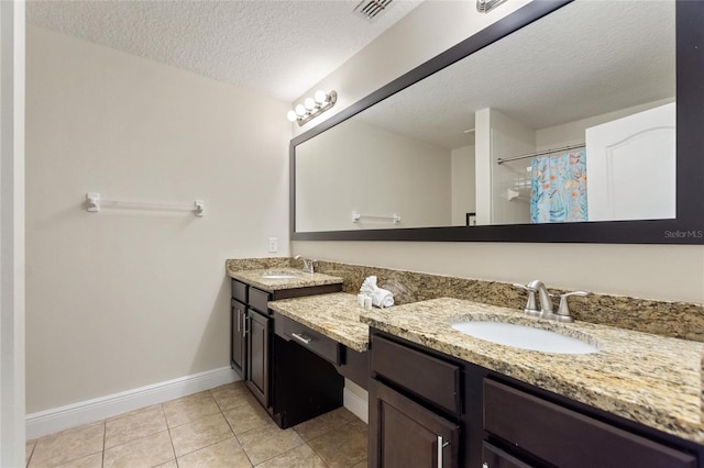 8205 Roseville, Davenport, FL 33896 - bathroom with double vanity, baseboards, tile patterned flooring, a textured ceiling, and a shower with shower curtain