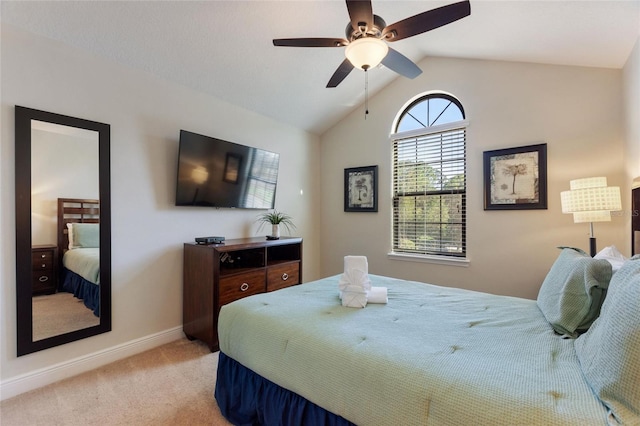 bedroom with light carpet, vaulted ceiling, and ceiling fan