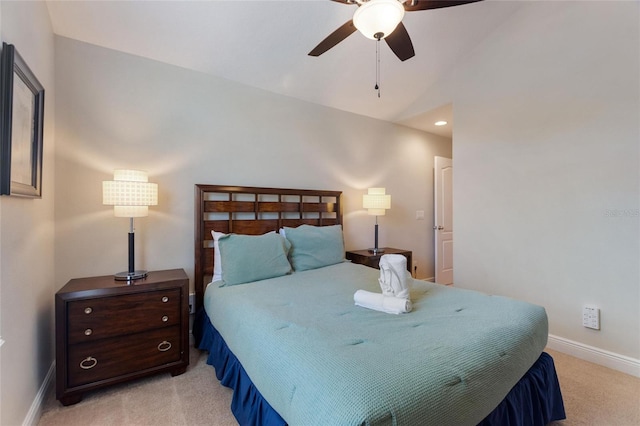 carpeted bedroom featuring ceiling fan and lofted ceiling