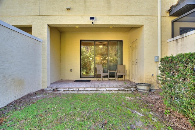 entrance to property featuring a patio