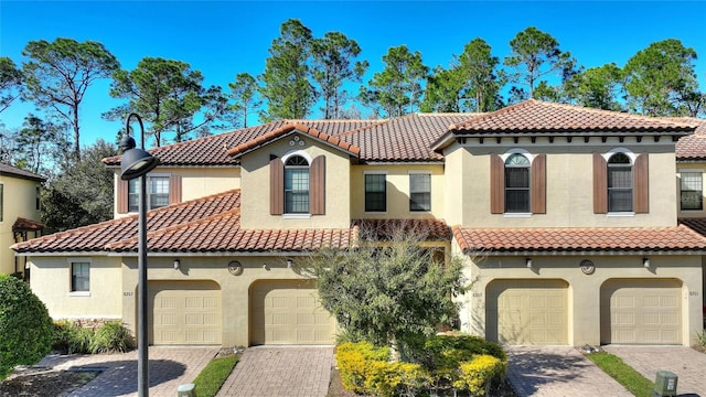 mediterranean / spanish-style home featuring a garage