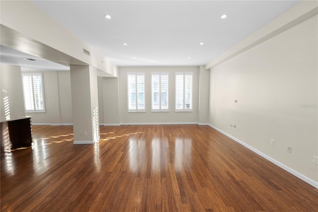 405 Central Ave Unit 210, Saint Petersburg, FL 33701 - unfurnished living room with wood finished floors, baseboards, and recessed lighting