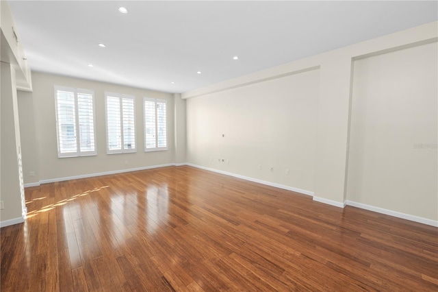 405 Central Ave Unit 210, Saint Petersburg, FL 33701 - unfurnished room with wood finished floors, baseboards, and recessed lighting