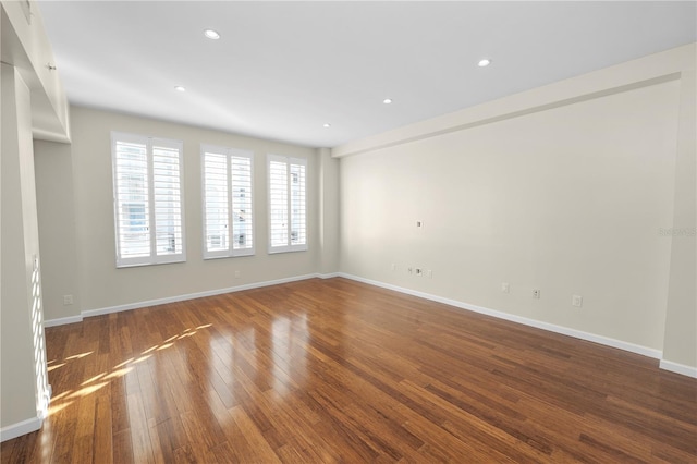 spare room featuring hardwood / wood-style flooring