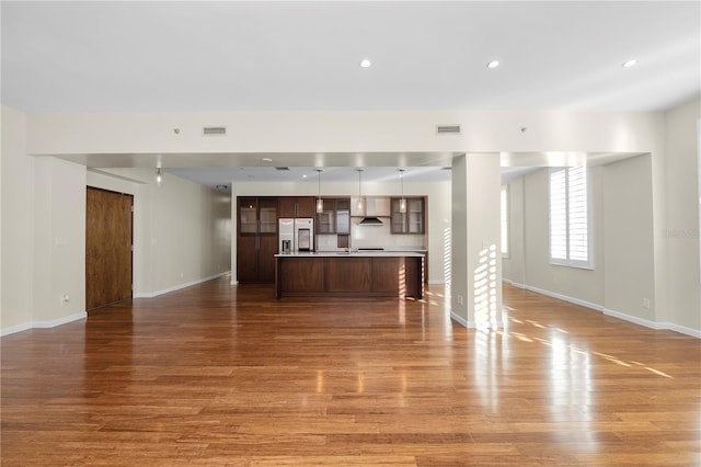 unfurnished living room featuring light hardwood / wood-style floors