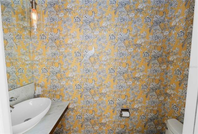 405 Central Ave Unit 210, Saint Petersburg, FL 33701 - half bath with toilet, wallpapered walls, and a sink