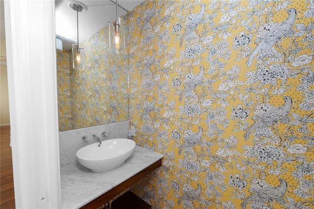 405 Central Ave Unit 210, Saint Petersburg, FL 33701 - bathroom with wallpapered walls and vanity