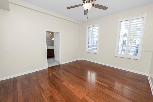 405 Central Ave Unit 210, Saint Petersburg, FL 33701 - unfurnished room featuring ceiling fan, baseboards, and wood finished floors