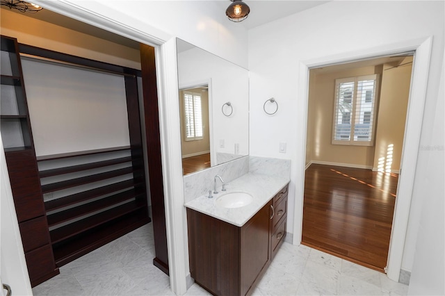 bathroom with vanity and hardwood / wood-style flooring