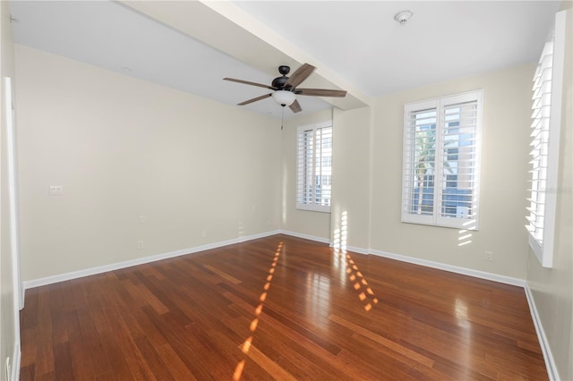 empty room featuring ceiling fan and wood-type flooring