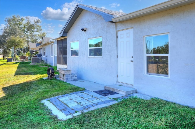 entrance to property with a yard