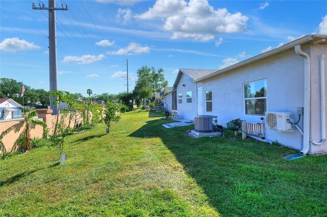 view of yard featuring central AC unit and ac unit