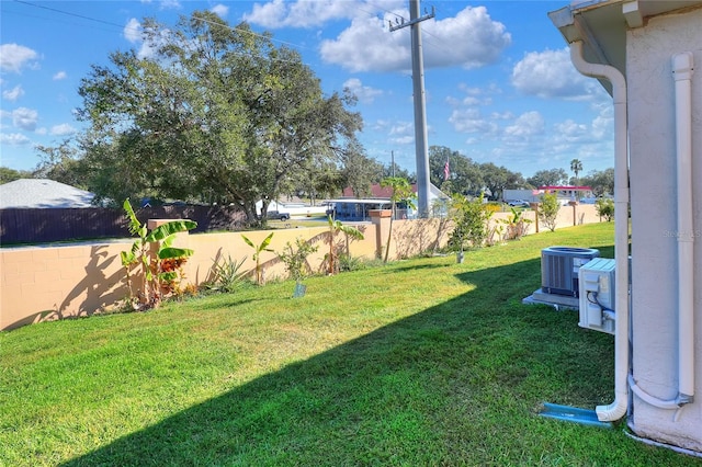 view of yard with central AC unit