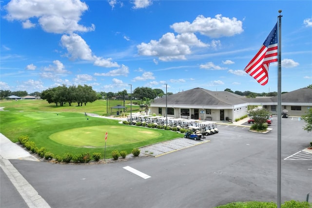 surrounding community featuring a lawn