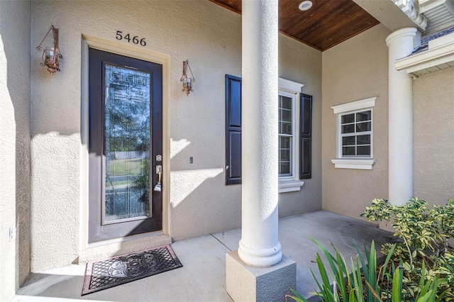 doorway to property featuring a porch