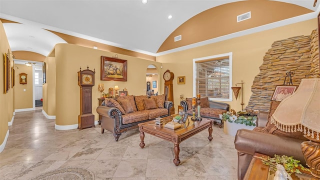 living room with high vaulted ceiling