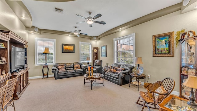 carpeted living room with ceiling fan