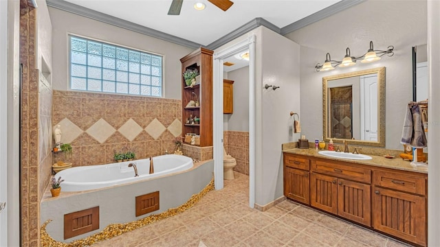 bathroom with a washtub, vanity, ornamental molding, and toilet