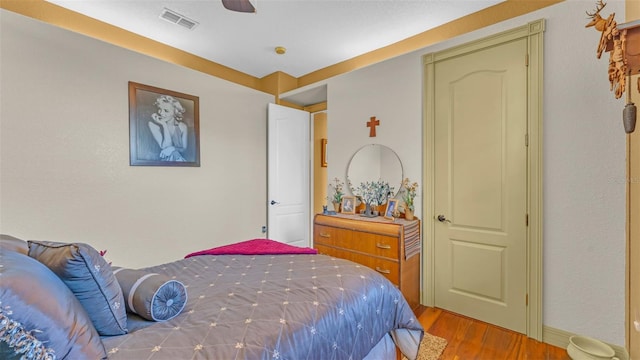 bedroom featuring ceiling fan and light hardwood / wood-style flooring